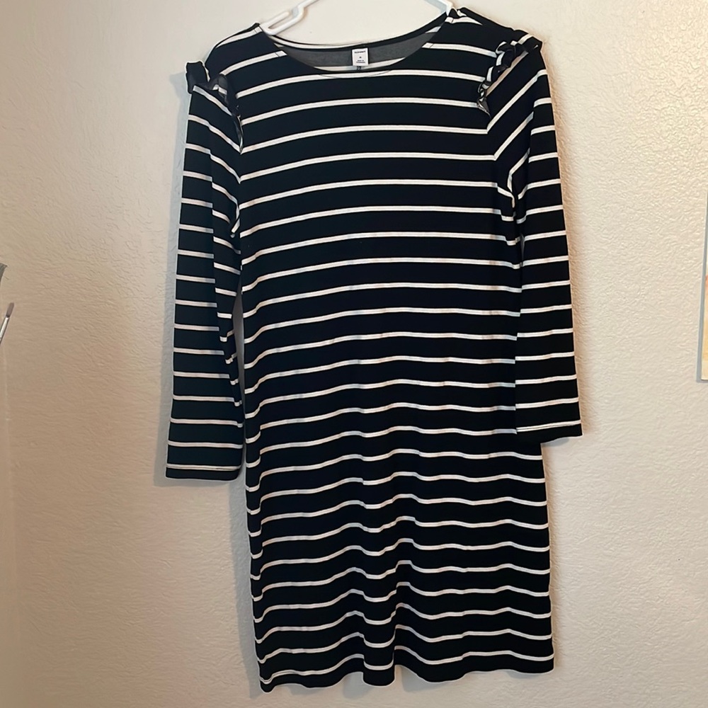 Black and white striped dress with ruffle detail at the shoulders